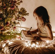 photo-of-girl-sitting-near-christmas-tree-3303613.jpg